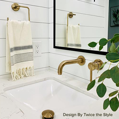 White bathroom with mix of black and gold metals