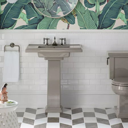 Tropical bathroom with pedestal sink and toilet