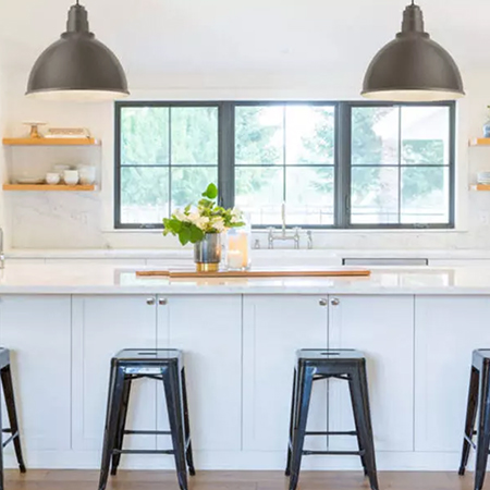 Chic and minimal kitchen with barn lighting