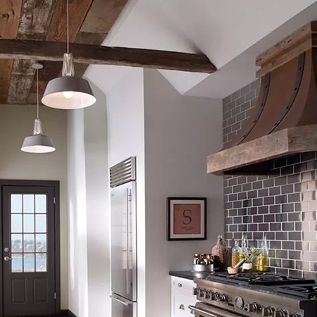 Coastal style kitchen with neutral colors and pendant lights