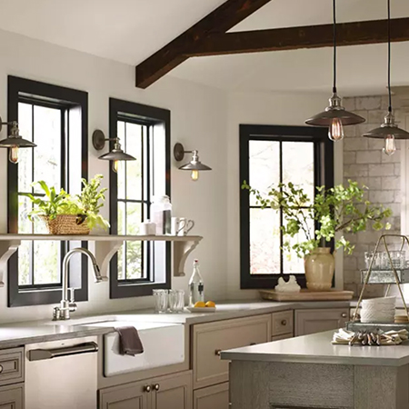 Traditional industrial style kitchen with pendants and wall sconces