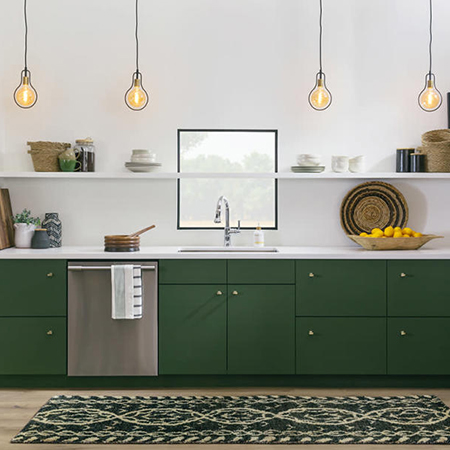White kitchen with forest green cabinets and industrial accents