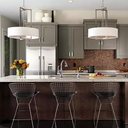 Kitchen with grey cabinets and pendant lights